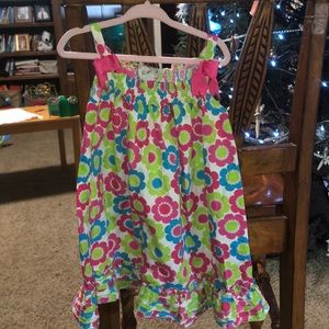 Girls floral sundress with ruffle bottom.